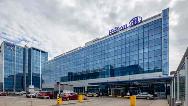 Modern Hilton Helsinki Airport business center with sleek glass facade for events.