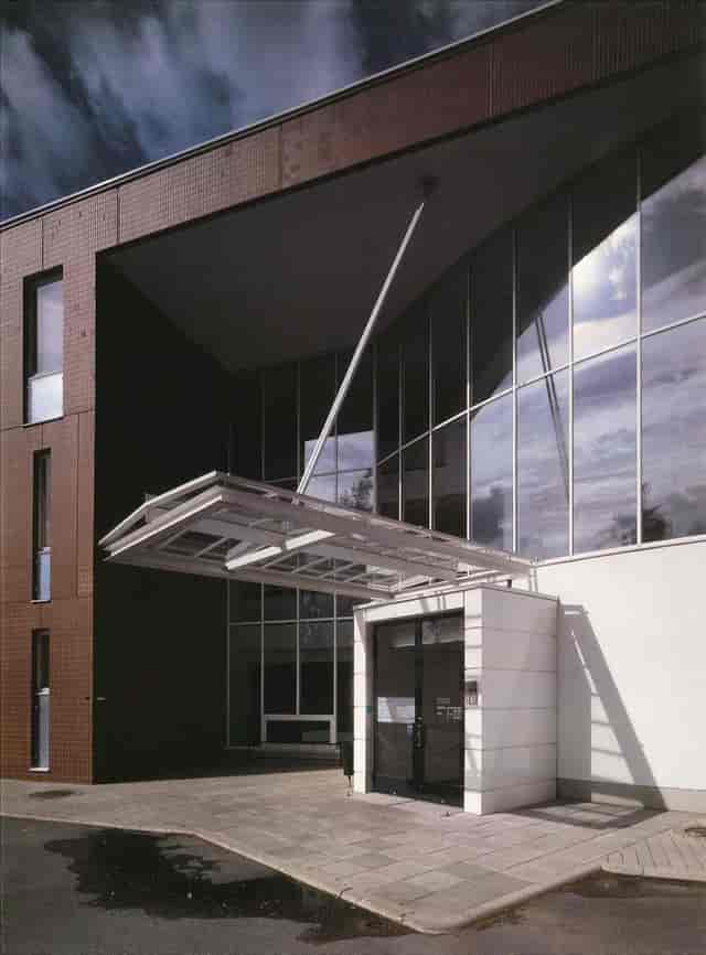 Modern gym façade with large glass windows, ideal for events in Munkkiniemi.