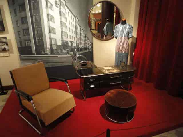 Vintage-inspired meeting space with mid-century modern chair in Helsinki City Museum.