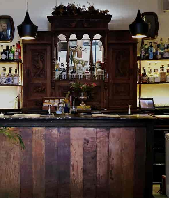 Ornate wooden bar at The Bubbly Bar, perfect for receptions and networking events.