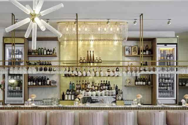 "Stylish bar area by Kove Collection, ideal for networking events and cocktails."