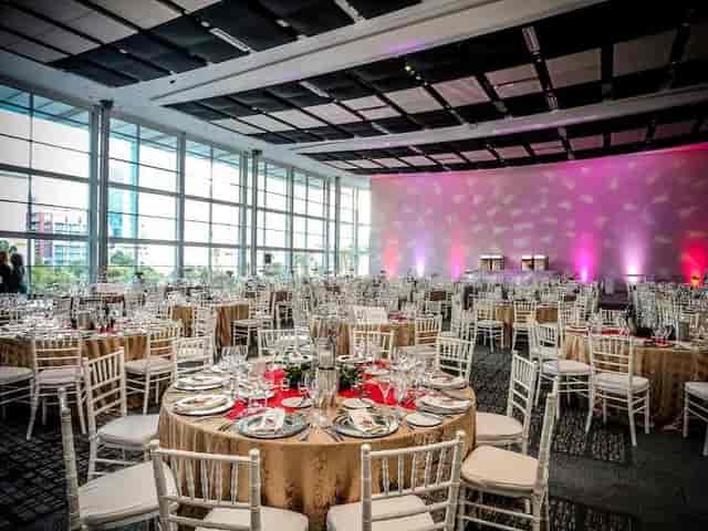 Elegant banquet hall with gold tablecloths at Cape Town Convention Centre for events.