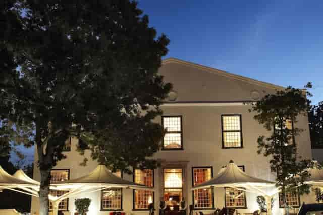 Incognito restaurant exterior with warm lighting, ideal for weddings and corporate events.