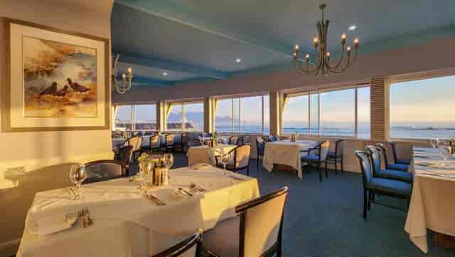 Elegant dining space at Blue Peter Hotel, waterfront view for events and receptions.