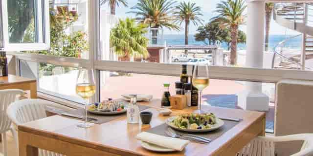 Tides Celebration Deck dining table with ocean view, ideal for networking lunches and events.
