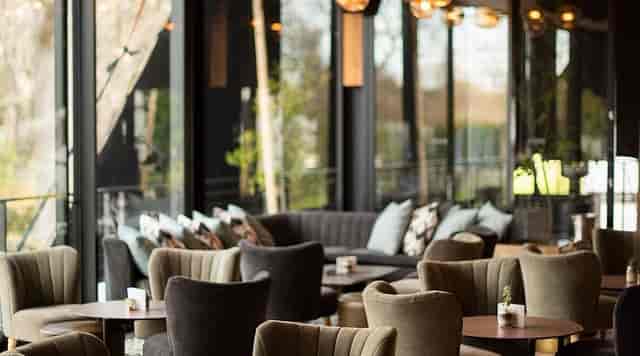 Stylish event space with plush seating, ideal for corporate meetings and gatherings.
