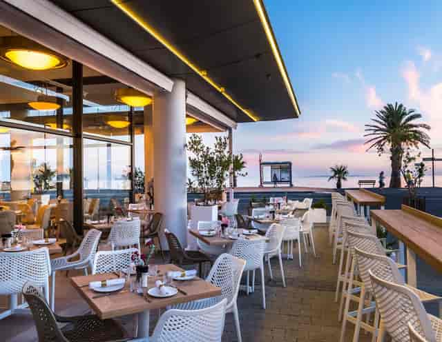 Lily's Kove outdoor dining area with ocean view, ideal for events and receptions.