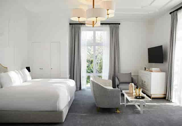 Modern hotel suite at The Alphen for meetings and retreats, featuring ample natural light.