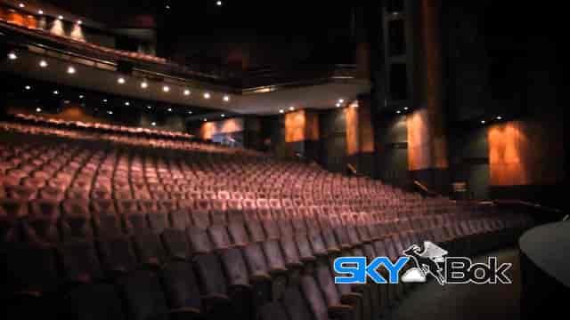 Theatre auditorium with plush seating, ideal for conferences and performances.
