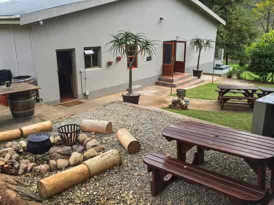 Farmhouse Erika outdoor space with fire pit, perfect for team-building events and workshops.