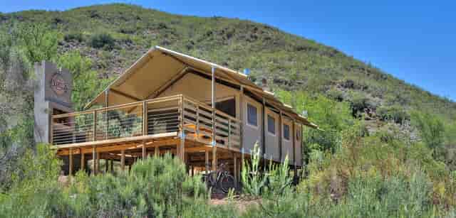 Cottages in Pat Busch Mountain Reserve, featuring a spacious deck for outdoor retreats.