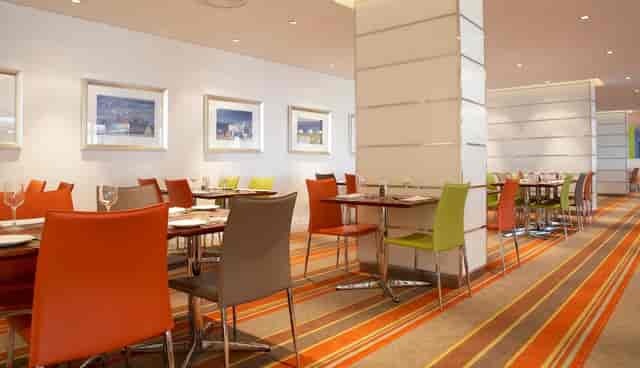 Modern restaurant venue with vibrant seating for events near Nelson Mandela Boulevard.
