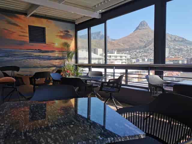 Vibrant meeting space with floor-to-ceiling windows in The Hyde All Suite Hotel.