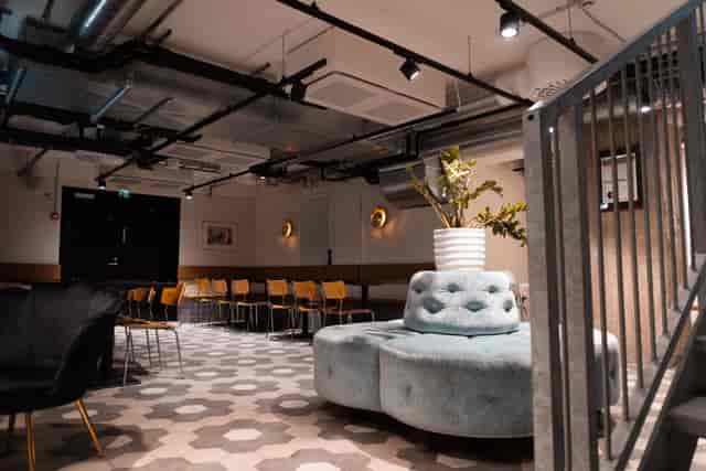Versatile event space in Pizzeria Via Tribunali, Kallio with modern design and greenery.