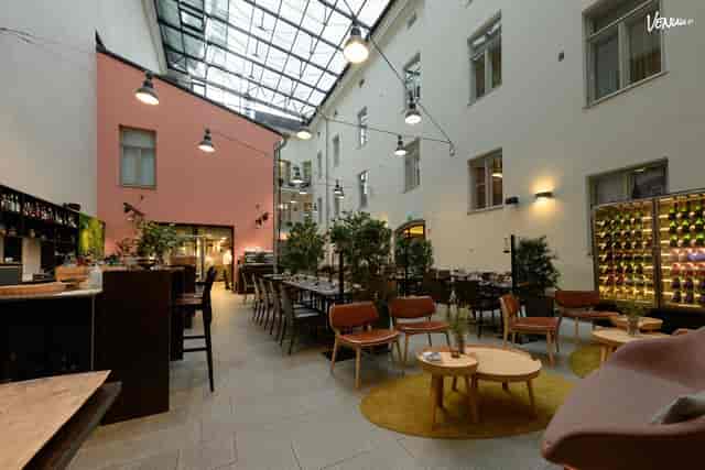 Versatile event space in Venuu with glass ceiling for networking events and dinners.