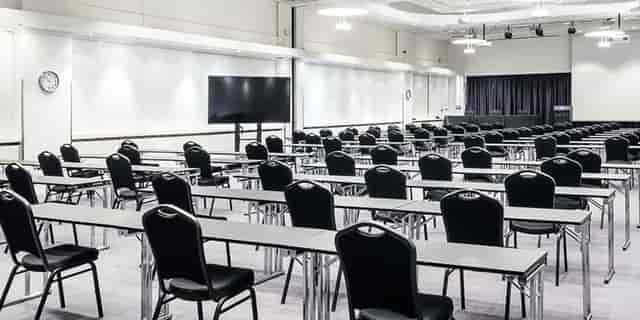 Conference setup in Winter Garden, Crowne Plaza Helsinki - Hesperia, featuring tables and chairs.