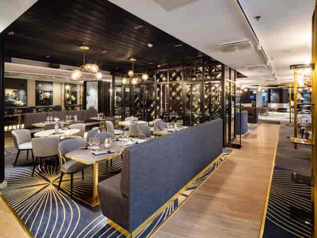 Sophisticated dining area in Crowne Plaza Helsinki for upscale events and gatherings.