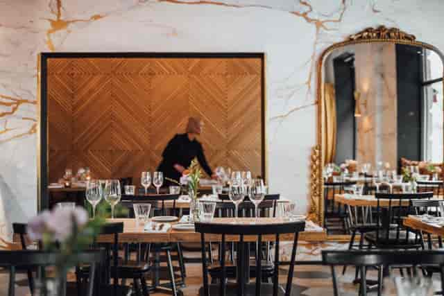 Elegant dining space in Pompier Espa, ideal for upscale events with refined decor.