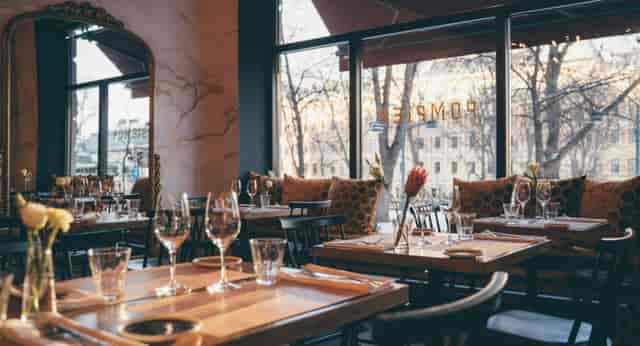 Stylish restaurant setup with elegant decor for corporate events and gatherings.