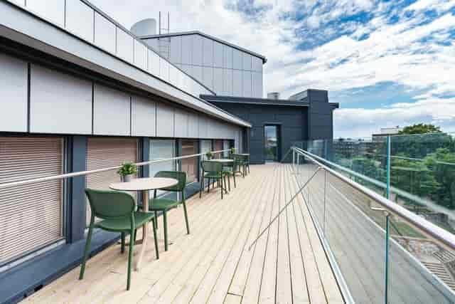Modern balcony space in VillageWorks, ideal for networking events and outdoor gatherings.