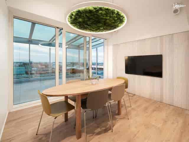 Modern meeting space at Sky Lounge with oval table, ideal for brainstorming and teamwork.