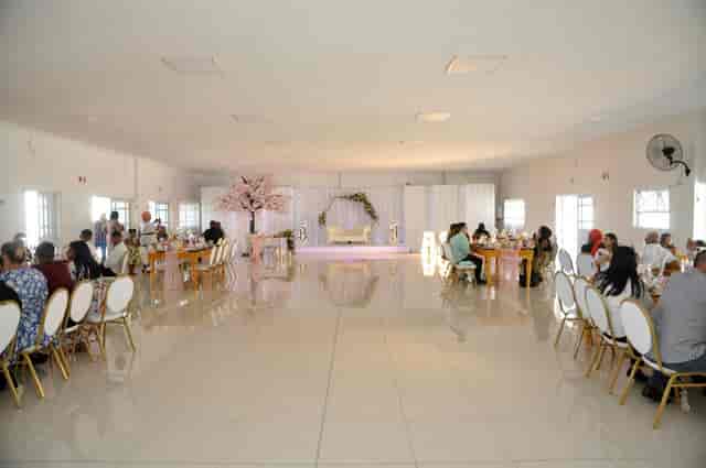 Spacious outdoor venue with elegant seating, perfect for weddings and corporate events.