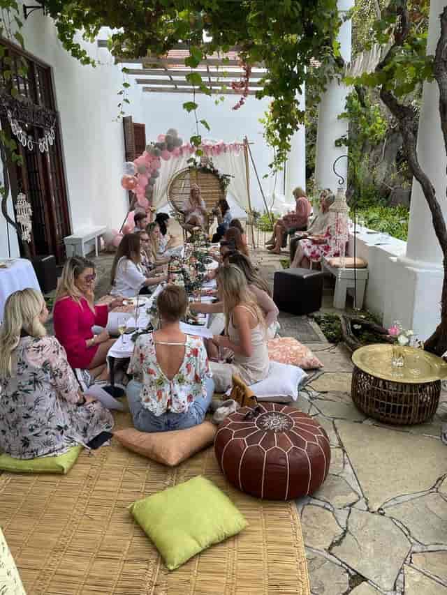 Elegant outdoor gathering at Manor House with pastel décor for chic events.