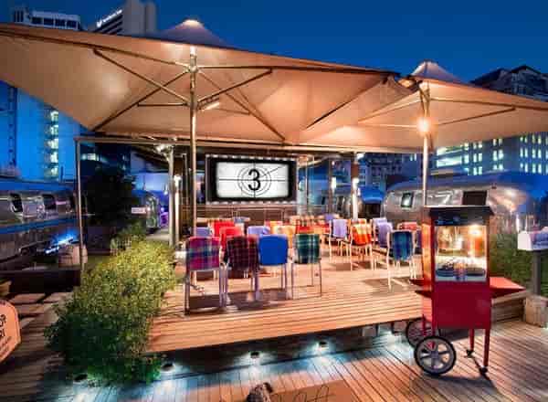Sky Bar at Grand Daddy Hotel: vibrant outdoor event space with colorful seating and canopies.