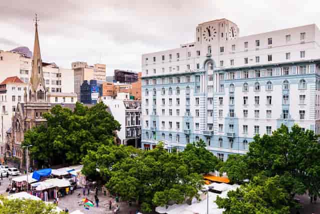 Alice at The Grand Daddy Hotel, elegant venue with clock tower for events and meetings.