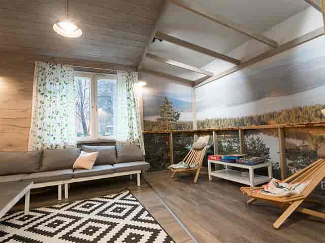 Cozy Eurohostel lounge with natural light, perfect for brainstorming and meetings.