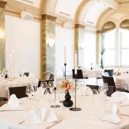 Elegant dining setup in Rake Ballroom, Klaus K Hotel for sophisticated events and galas.