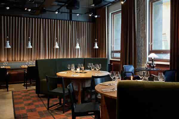 Elegant dining space at Kokka-keittiö, ideal for intimate events and meetings.