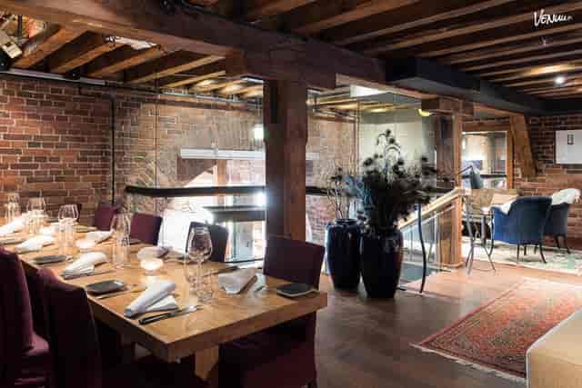 Häät at Ravintola Nokka: elegant dining space with rustic beams for upscale events.