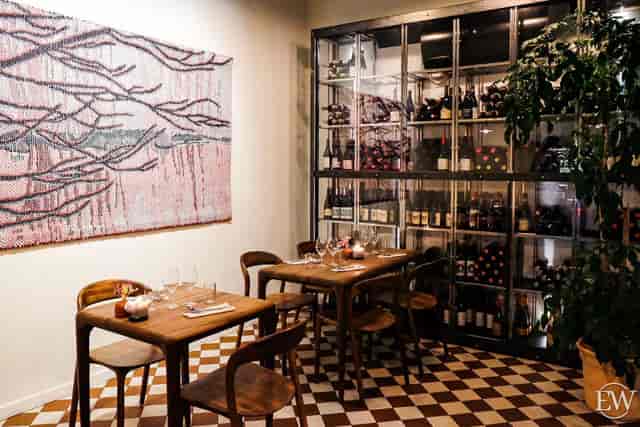 Intimate kitchen table at Restaurant Nolla, perfect for private events and networking.