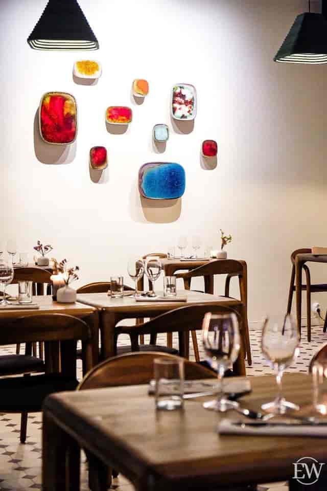 Sophisticated minimalist dining space at Restaurant Nolla for intimate gatherings.