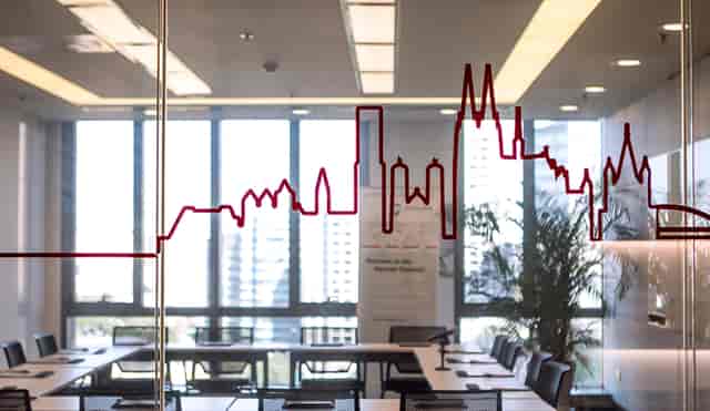 Modern meeting room with skyline view for corporate events and presentations.