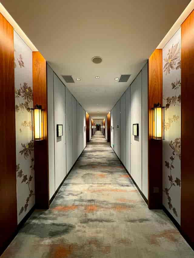 "Elegant hotel corridor at Taipan I, Mandarin Oriental Beijing, perfect for events."