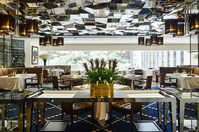 Main Dining Room at 8½ Otto e Mezzo BOMBANA, elegant décor for upscale events and meetings.