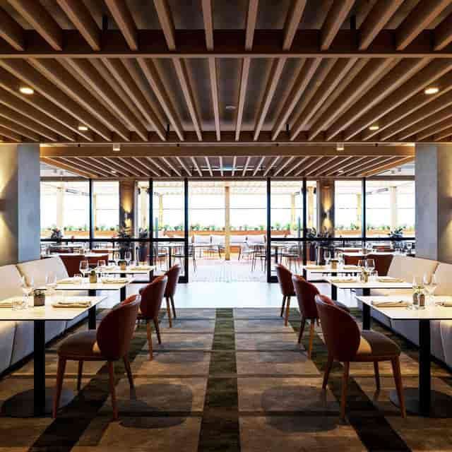 Modern restaurant venue with natural light for corporate meetings and private events.