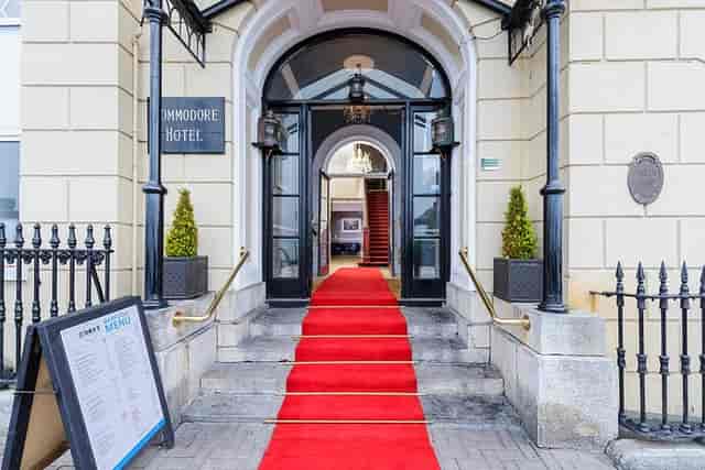 Elegant red carpet entrance at Commodore Hotel's Club Lounge, perfect for receptions and conferences.