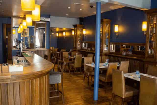 Intimate O'Shea’s Bistro restaurant with elegant wood bar, perfect for events and meetings.