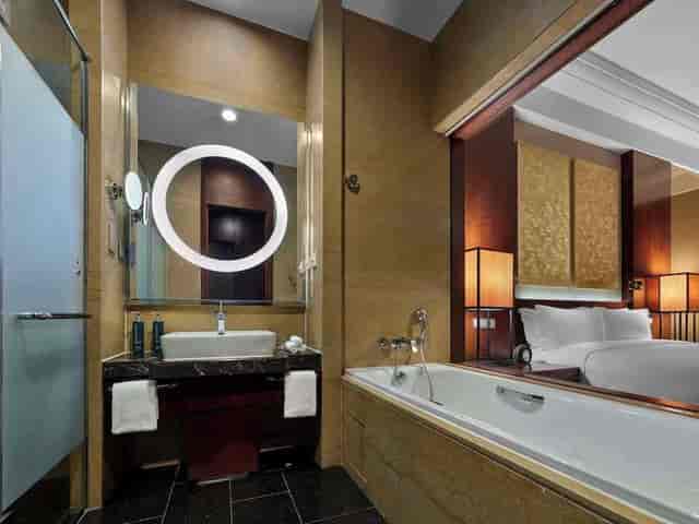 Luxurious Hilton Beijing conference room with modern fixtures for events and meetings.