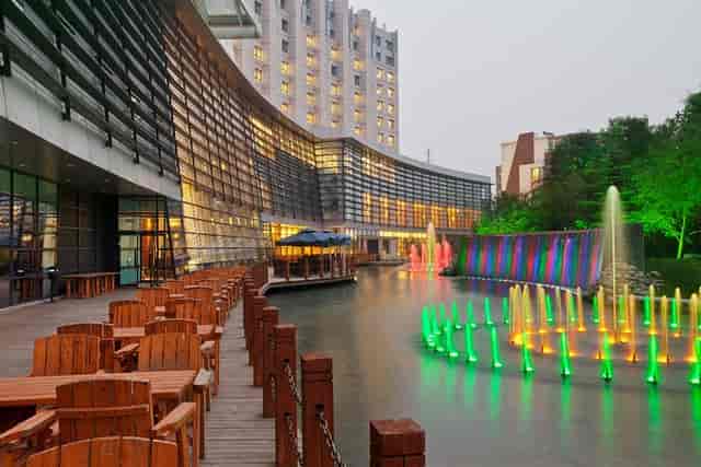 Vibrant outdoor event space at Crowne Plaza Beijing with modern design and water features