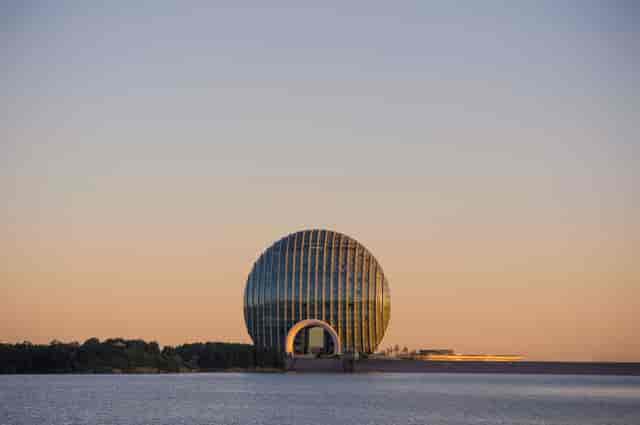Kempinski Grand Ballroom at sunset, modern architecture ideal for conferences and events.