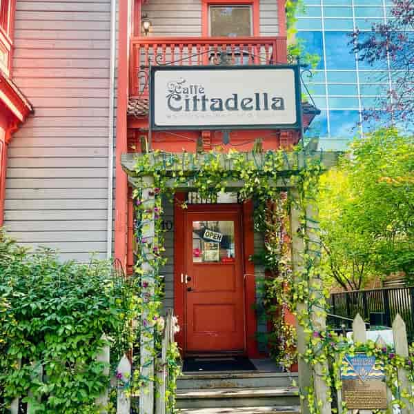 Charming restaurant entrance at Caffe Cittadella, ideal for events and gatherings.
