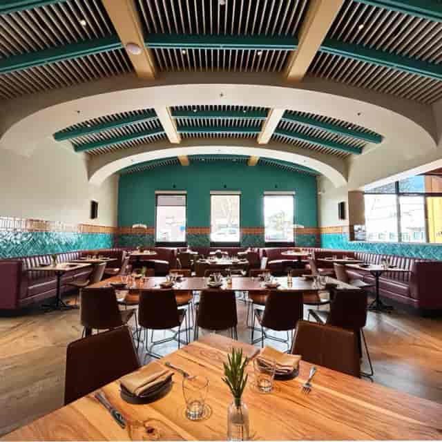 Modern restaurant space with vibrant decor, ideal for events and private dining.