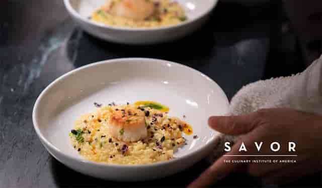 Elegant scallops on creamy risotto for upscale corporate events and gatherings.