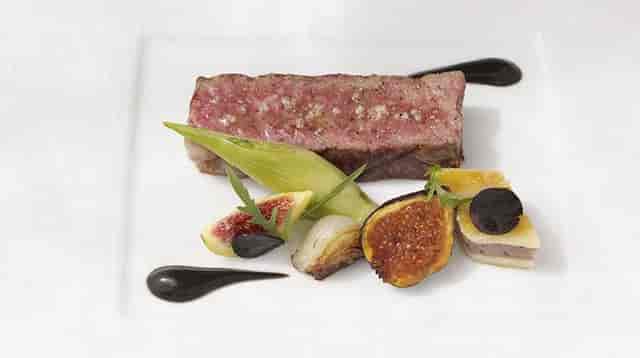 Elegant Private Room at The French Laundry with artfully plated gourmet meat dish.