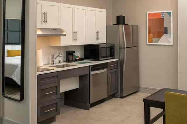 Modern kitchenette in Homewood Suites Belmont, perfect for meetings and events.