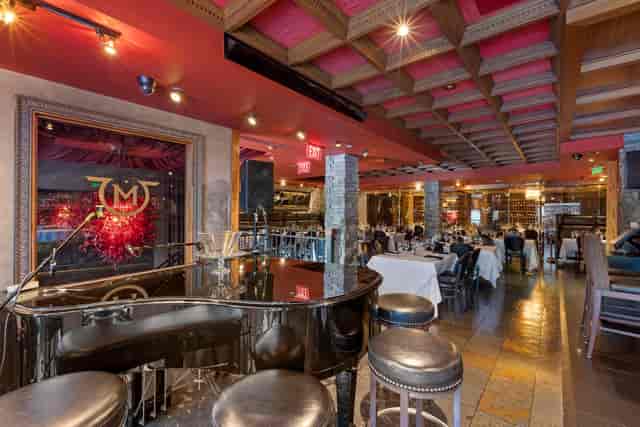 Metropolitan Room at Mastro's: elegant dining with piano, perfect for upscale events.